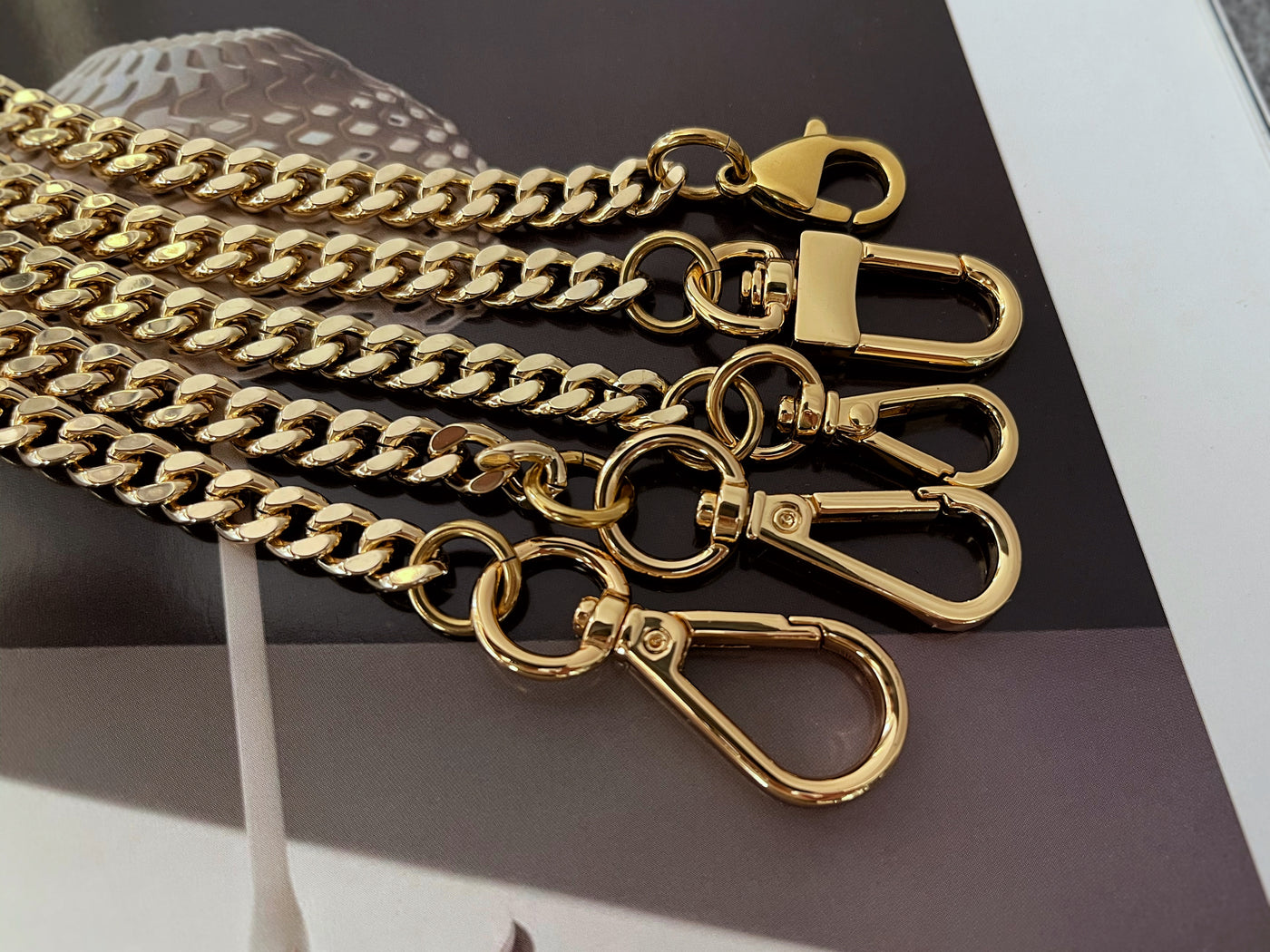 Just add a chain on it! Our new chunky chain comes in silver and antique  gold! I am really into dressing up my bags with chains and strap